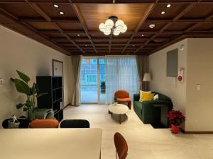 a living room with a couch and a table at DADU House in Seoul