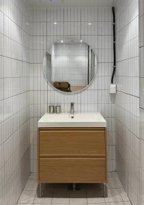 a bathroom with a sink and a mirror at DADU House in Seoul +134 photos