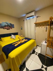 Postel nebo postele na pokoji v ubytování Casa Silveira Noronha