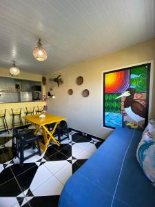 a room with a table and a dining room at Casa Silveira Noronha in Fernando de Noronha