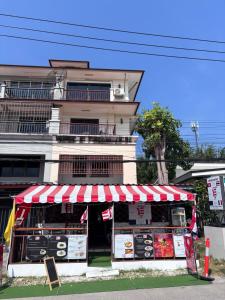 a food stand in front of a building at Jura 88 Guesthouse in Hua Hin