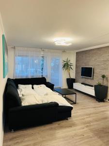a bedroom with a large bed and a tv at Schöne Ferien Wohnung in Breisach 3 Zimmer in Breisach am Rhein