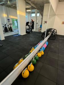 a row of bowling balls on a track in a gym at The Beach Resort in Koh Rong Island