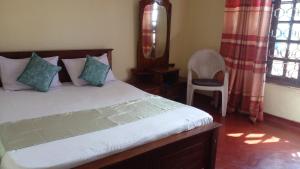 Кровать или кровати в номере Haranya Homestay