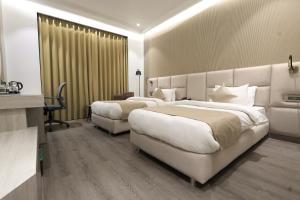Hotel Swarn Towers客房内的一张或多张床位