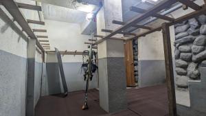 a room with a bunch of skis on a wall at See 遊 in HAKUBA 和楽 in Hakuba