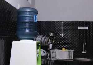 Kuchyň nebo kuchyňský kout v ubytování Trion Homestay Syariah + 14 fotografií
