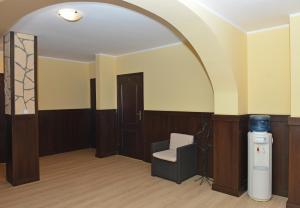 an empty room with a chair and a heater at Arkadia Radziejów in Radziejów