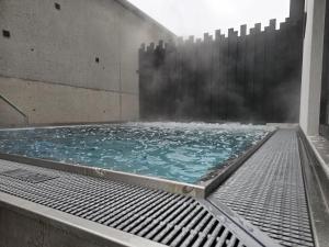 a swimming pool with water coming out of it at Chalet in Zillertal near Ski Slopes in Aschau