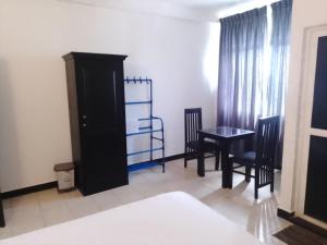 Postel nebo postele na pokoji v ubytování Akira Beach Hotel