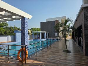 a swimming pool on the roof of a building at Sagar Kuthi in Mandarmoni