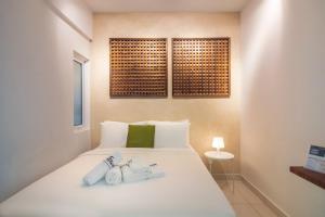 Postel nebo postele na pokoji v ubytování Maritime Suites by Stellar ALV