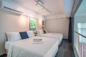 Postel nebo postele na pokoji v ubytování Maritime Suites by Stellar ALV