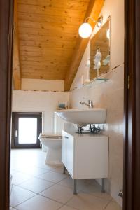 a bathroom with a sink and a toilet at Casa Buonaiuto in Castellabate +26 photos