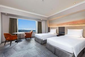 Postel nebo postele na pokoji v ubytování Hilton Tokyo Narita Airport