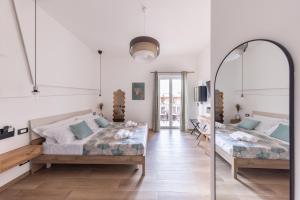 Armony Luxury Suites客房内的一张或多张床位