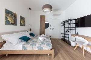 Armony Luxury Suites客房内的一张或多张床位