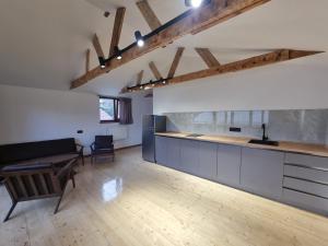 a kitchen with a counter and a table at Guest house in Dilijan , whole apartment with 2 bedrooms in Dilijan