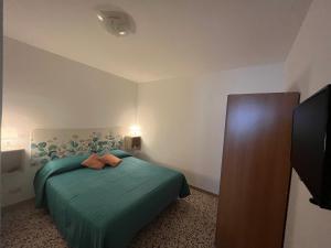 Un pat sau paturi într-o cameră la La Casa dei Ricordi