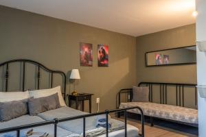 a bedroom with two beds and a bedskirts at Guest House Malusha in Gabrovo