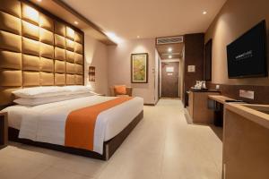 Postel nebo postele na pokoji v ubytování Eastparc Hotel Yogyakarta