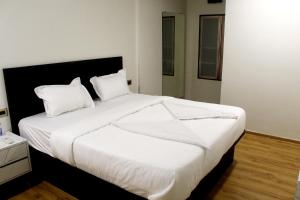 4 Points Lodging & Boarding房間的床