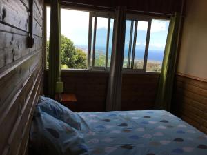 Postel nebo postele na pokoji v ubytování Chalet confortable avec vue panoramique