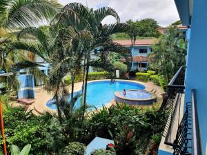 a view of a pool from the balcony of a resort at Marina Loft Condos 223 in Coco