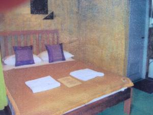 Postel nebo postele na pokoji v ubytování Tamarind Grand Resort Mae Sariang
