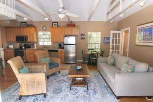 a living room with a couch and a table at The Southern Cross Tropical Village in Key West