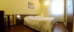 Postel nebo postele na pokoji v ubytování Hotel Mariani