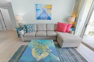a living room with a couch and a table at Sunrise Suite 203 in Key West +32 photos