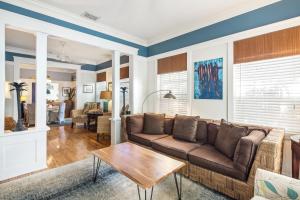 a living room with a couch and a table at Casa De Cuba in Key West