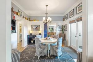a dining room with a table and chairs at Casa De Cuba in Key West +32 photos