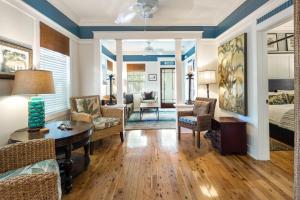 a living room with a bed and a table at Casa De Cuba in Key West