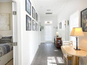 a room with a table and a bed and a desk at Starfish in Key West