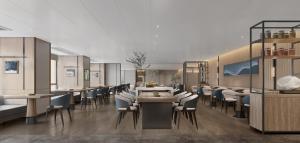 a restaurant with tables and chairs in a room at Somerset Wanxia Shenzhen in Shenzhen