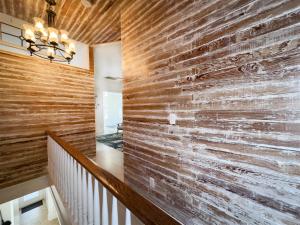 a brick wall in a hallway with a staircase at Olivias Landing in Key West