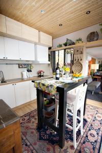 a kitchen with a table and chairs in a kitchen at Glass Home Nature meets Luxury in Nea Makri