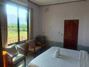 Ένα ή περισσότερα κρεβάτια σε δωμάτιο στο DD guesthouse
