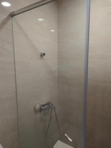 a bathroom with a shower with a toilet in it at 海雲間 in Taitung City +2 photos