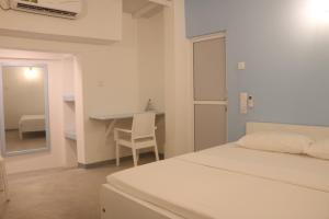 Postel nebo postele na pokoji v ubytování A.V.N HOMESTAY