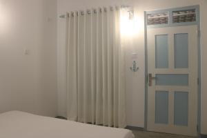 Postel nebo postele na pokoji v ubytování A.V.N HOMESTAY