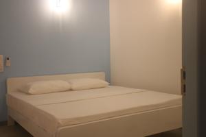 Postel nebo postele na pokoji v ubytování A.V.N HOMESTAY