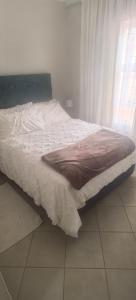 Ένα ή περισσότερα κρεβάτια σε δωμάτιο στο Lerato's Guesthouse 840 +7 φωτογραφίες