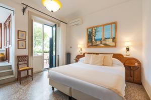 Postel nebo postele na pokoji v ubytování Hotel Villa Schuler