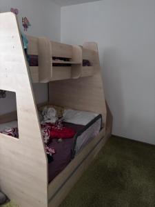 a bedroom with two bunk beds in a room at Angels Home Apartment in Bucharest