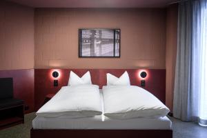 Lova arba lovos apgyvendinimo įstaigoje BRIX - Self Check-In Hotel