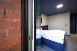 Lova arba lovos apgyvendinimo įstaigoje BRIX - Self Check-In Hotel