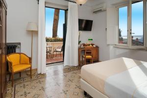 Postel nebo postele na pokoji v ubytování Hotel Villa Schuler